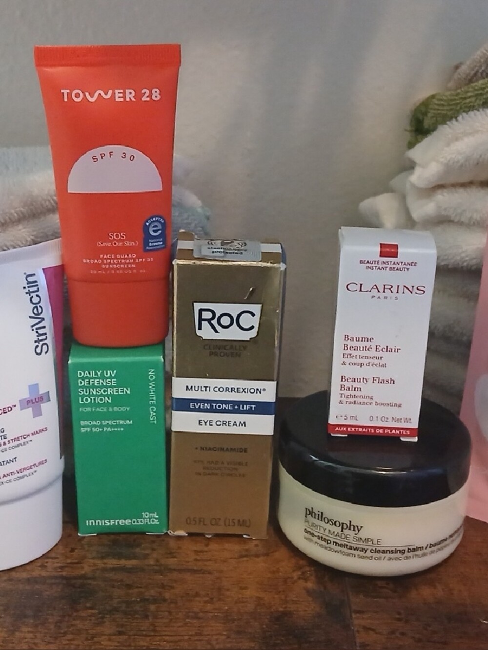 Clarins pink and white skincare trio with jar